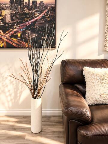 1 Bedroom Guest House Villa - HV2 living room detail with leather sofa and floor vase